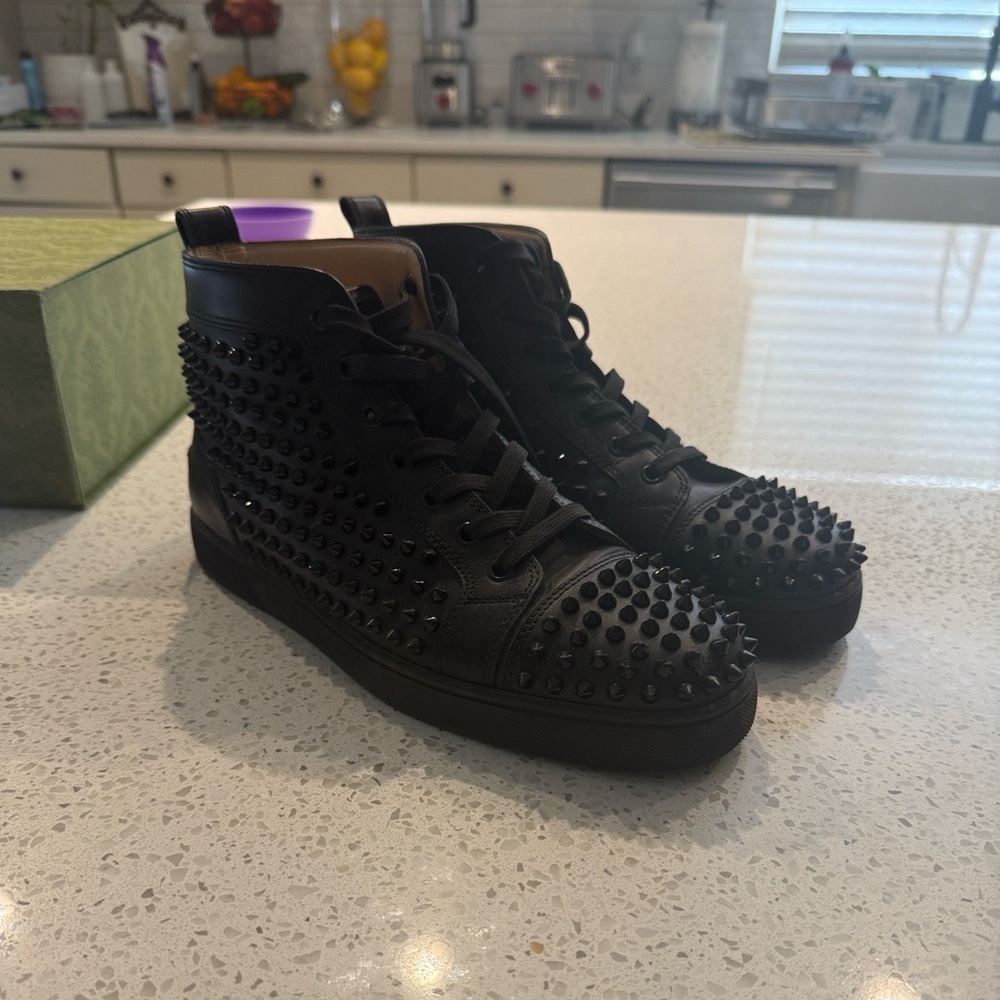 Christian Louboutin black spiked red bottoms